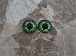 2 st drakögon kattögon i glas, glasinfattningar, cabochoner (12 mm)
