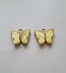 2 st fjärilar, fjärilsberlocker, charms berlock (Gul emalj)
