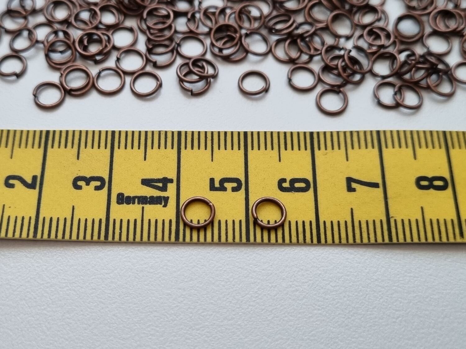 100 st jumprings / bindringar (5 mm, kopparfärgade)