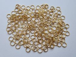 100 st jumprings / bindringar (5 mm, guldfärgade)