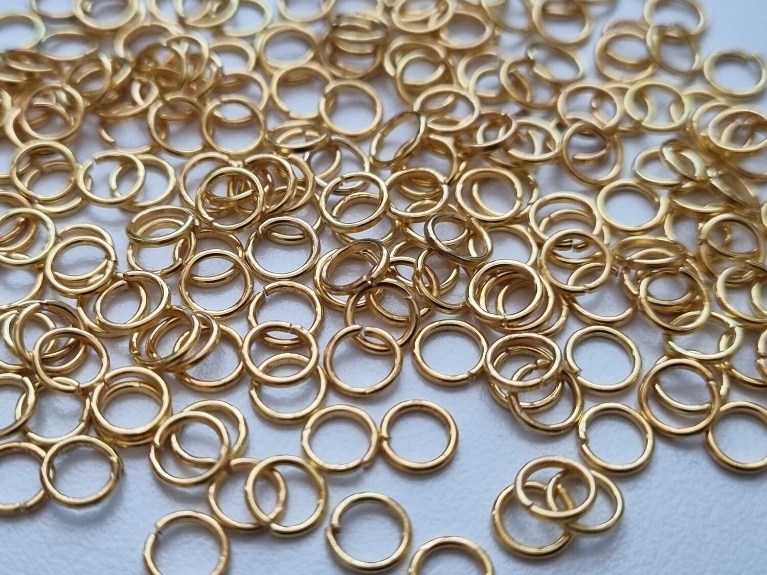 100 st jumprings / bindringar (5 mm, guldfärgade)
