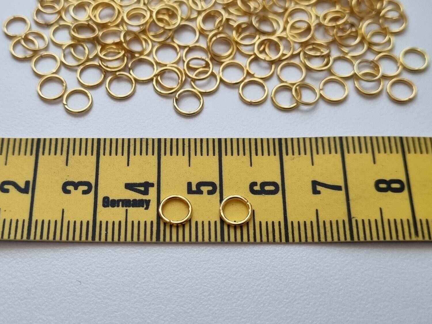 100 st jumprings / bindringar (5 mm, guldfärgade)