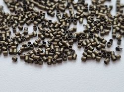 450 st bronsfärgade klämpärlor, crimp beads (1,5 mm)