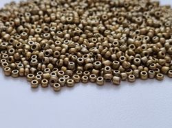 1000 små pärlor, fröpärlor, glaspärlor (2 mm) - Guldfärgade