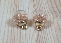 2 st runda glasberlocker, miniflaskor / glasbollar med ögla (beige fyllning)