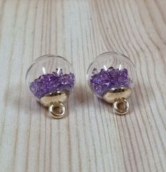 2 st runda, fyllda miniflaskor / glasflaskor med ögla (lila fyllning)