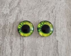 2 st drakögon kattögon i glas, glasinfattningar, cabochoner (12 mm)