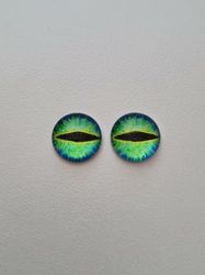 2 st drakögon kattögon i glas, glasinfattningar, cabochoner (12 mm)