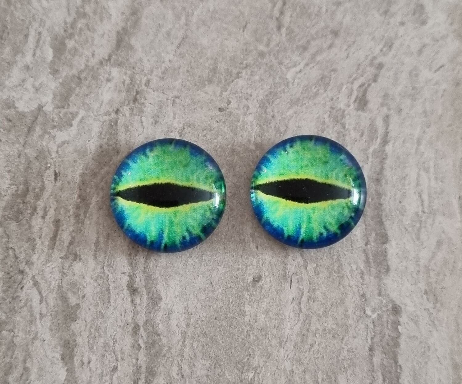 2 st drakögon kattögon i glas, glasinfattningar, cabochoner (12 mm)