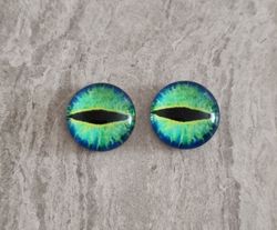 2 st drakögon kattögon i glas, glasinfattningar, cabochoner (12 mm)