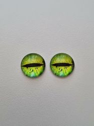 2 st drakögon kattögon i glas, glasinfattningar, cabochoner (12 mm)