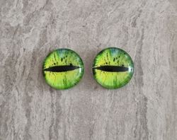 2 st drakögon kattögon i glas, glasinfattningar, cabochoner (12 mm)
