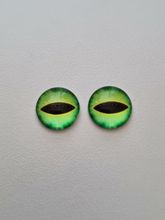 2 st drakögon kattögon i glas, glasinfattningar, cabochoner (12 mm)
