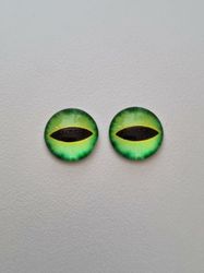2 st drakögon kattögon i glas, glasinfattningar, cabochoner (12 mm)