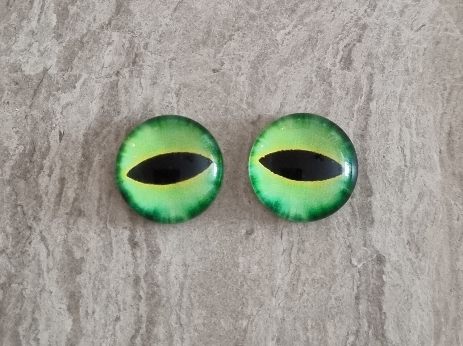 2 st drakögon kattögon i glas, glasinfattningar, cabochoner (12 mm)