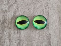 2 st drakögon kattögon i glas, glasinfattningar, cabochoner (12 mm)