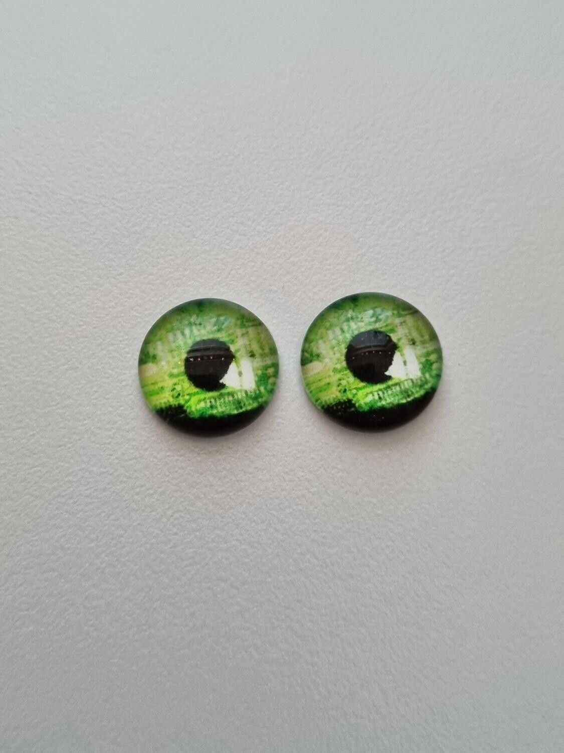 2 st drakögon kattögon i glas, glasinfattningar, cabochoner (12 mm)