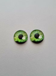 2 st drakögon kattögon i glas, glasinfattningar, cabochoner (12 mm)