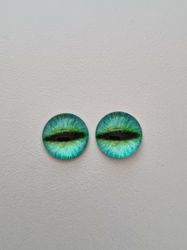 2 st drakögon kattögon i glas, glasinfattningar, cabochoner (12 mm)