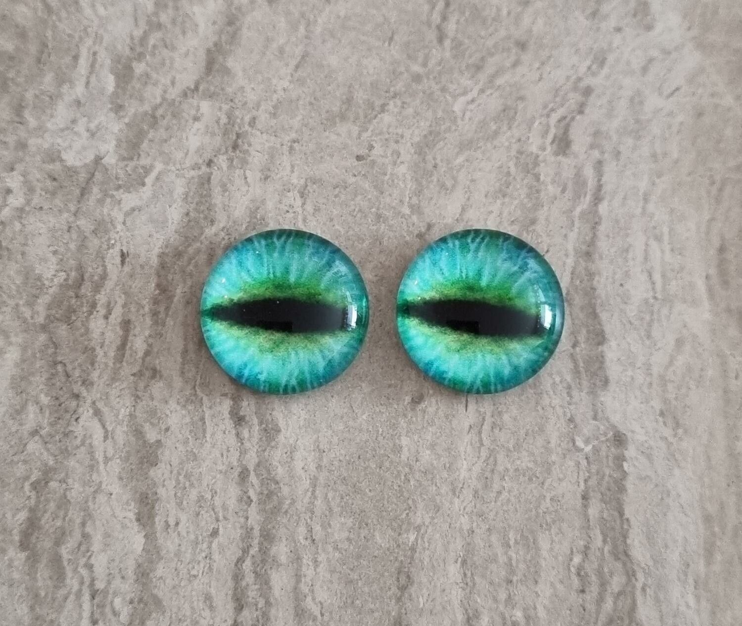 2 st drakögon kattögon i glas, glasinfattningar, cabochoner (12 mm)