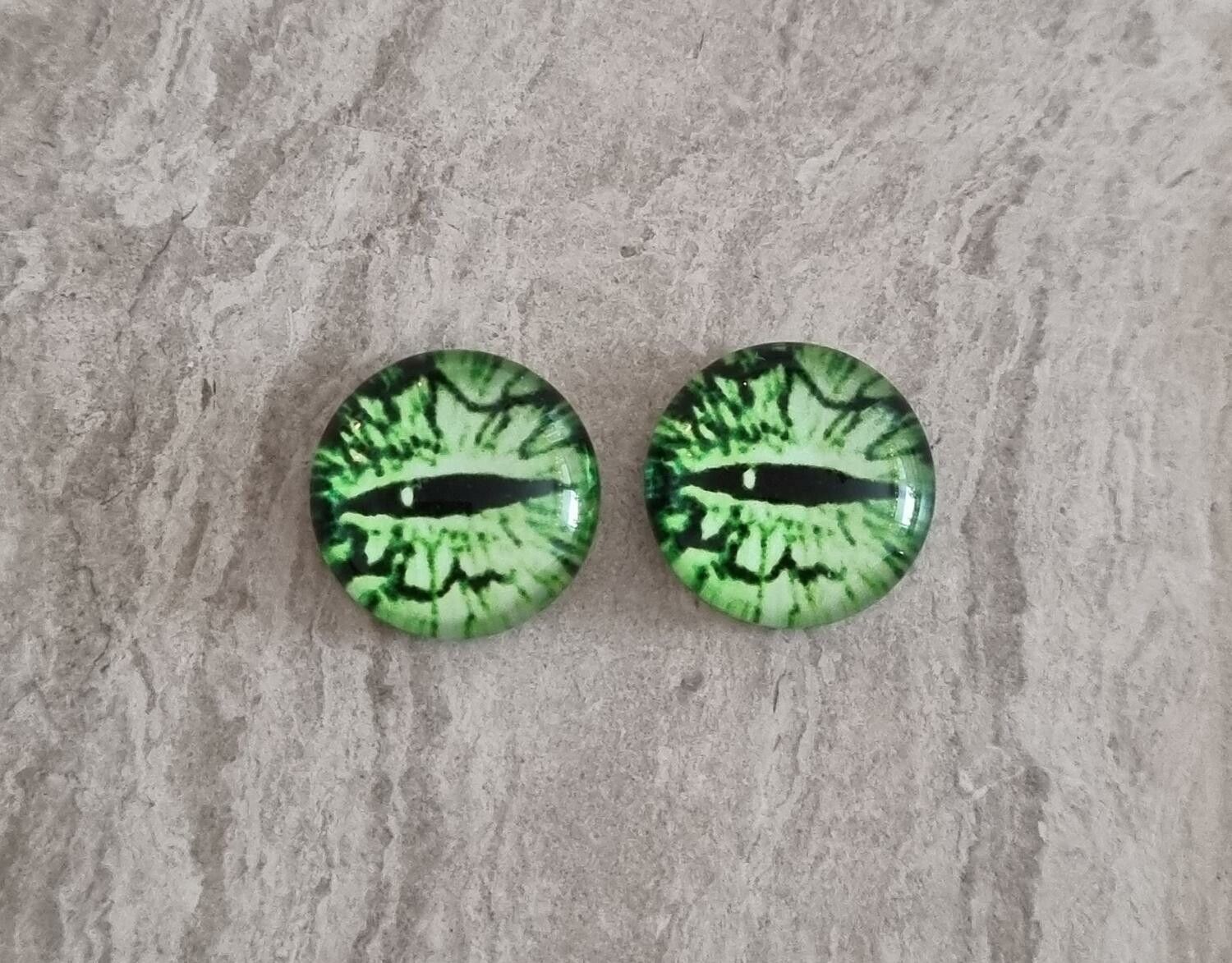 2 st drakögon kattögon i glas, glasinfattningar, cabochoner (12 mm)