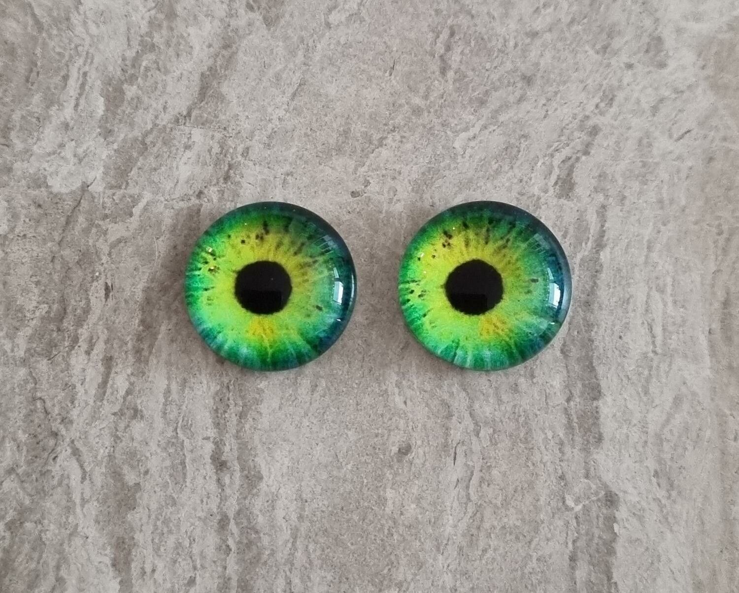 2 st drakögon kattögon i glas, glasinfattningar, cabochoner (12 mm)
