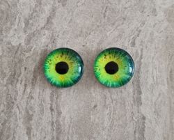 2 st drakögon kattögon i glas, glasinfattningar, cabochoner (12 mm)