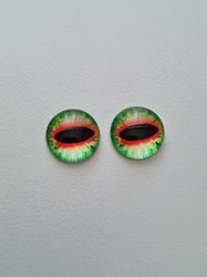 2 st drakögon kattögon i glas, glasinfattningar, cabochoner (12 mm)