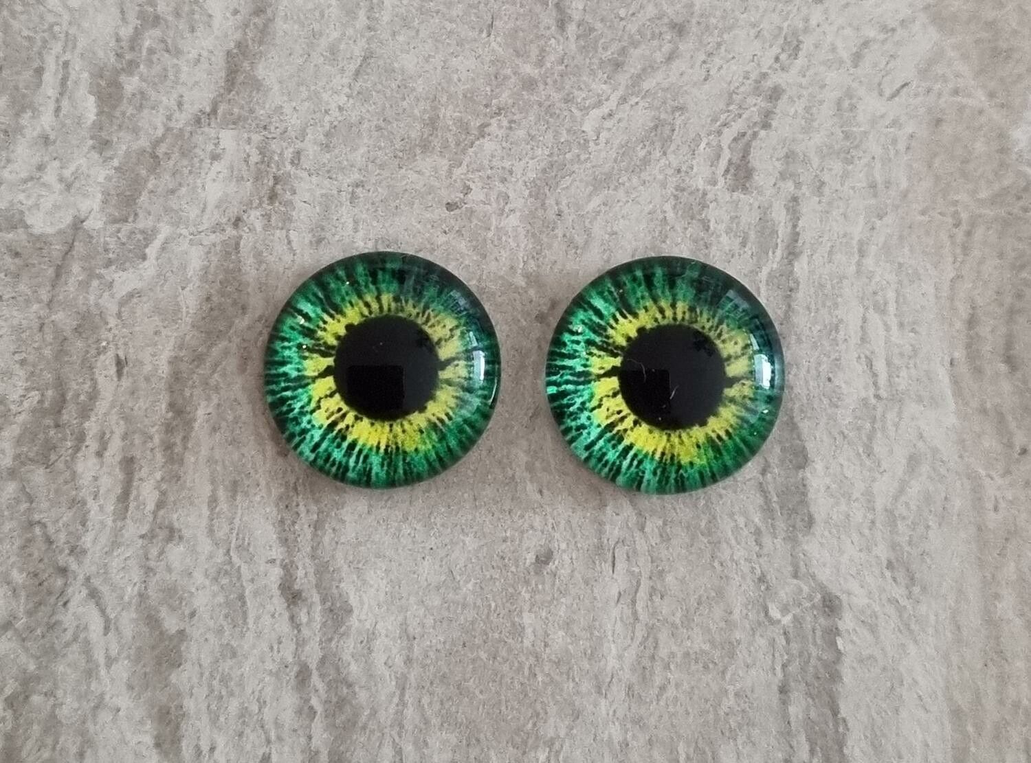 2 st drakögon kattögon i glas, glasinfattningar, cabochoner (12 mm)