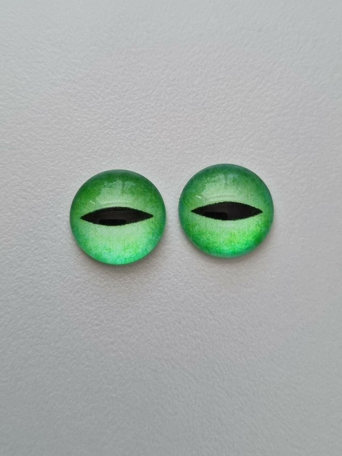 2 st drakögon kattögon i glas, glasinfattningar, cabochoner (12 mm)