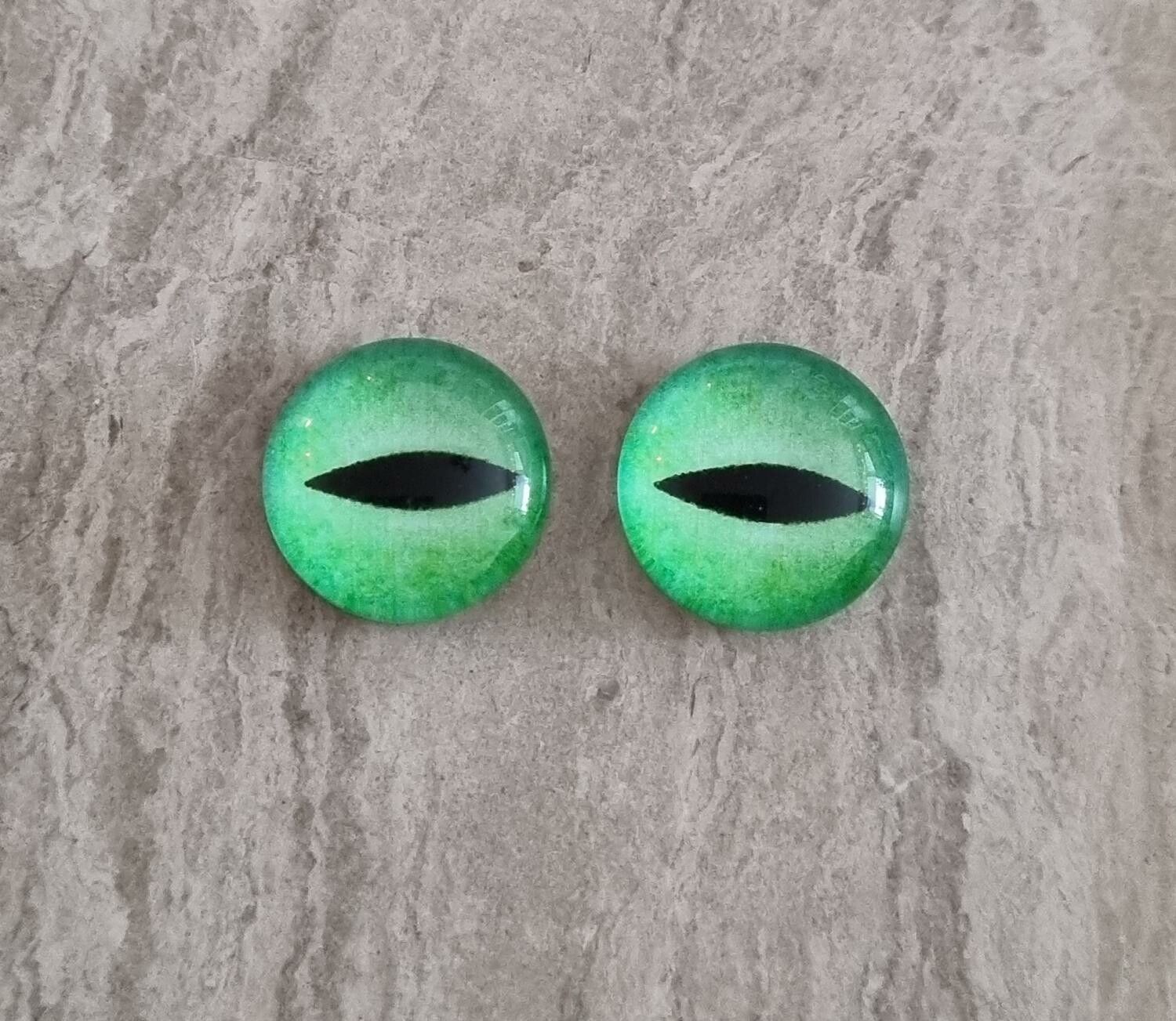 2 st drakögon kattögon i glas, glasinfattningar, cabochoner (12 mm)