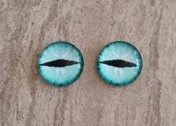 2 st drakögon kattögon i glas, glasinfattningar, cabochoner (12 mm)