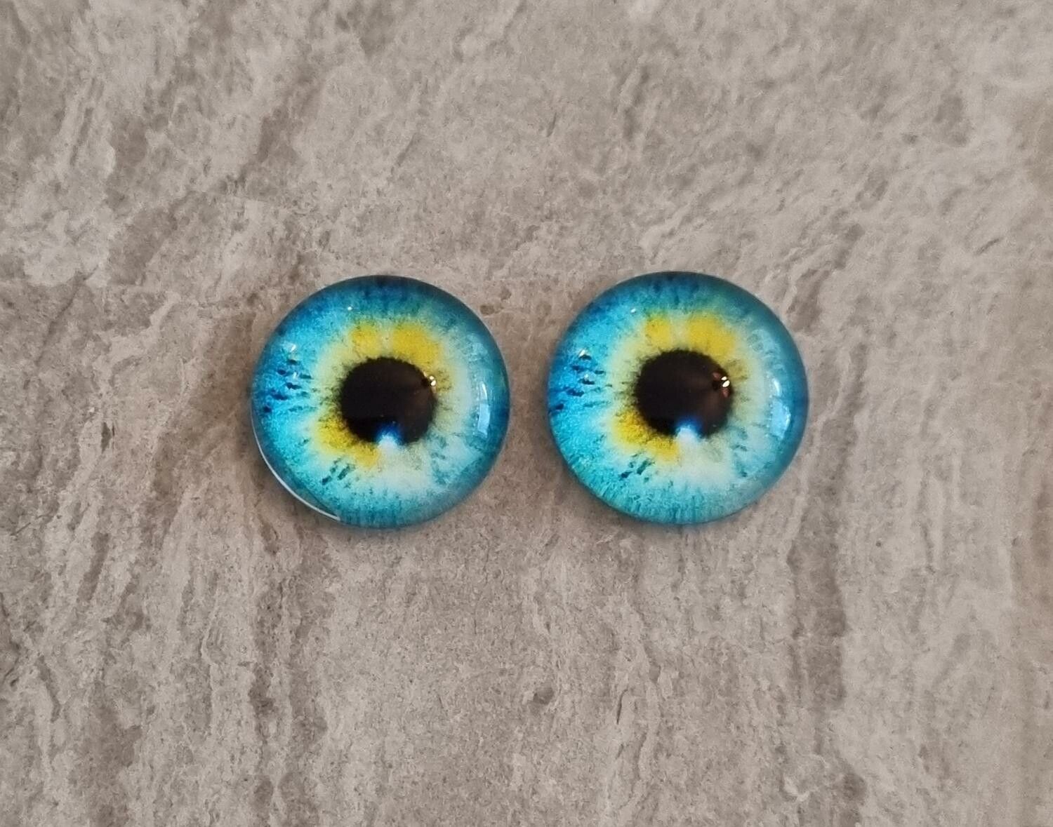 2 st drakögon kattögon i glas, glasinfattningar, cabochoner (12 mm)