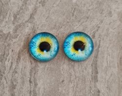 2 st drakögon kattögon i glas, glasinfattningar, cabochoner (12 mm)