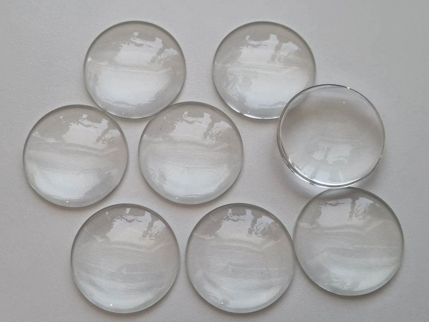 1 stor transparent cabochon i glas, glasinfattning (35 mm)