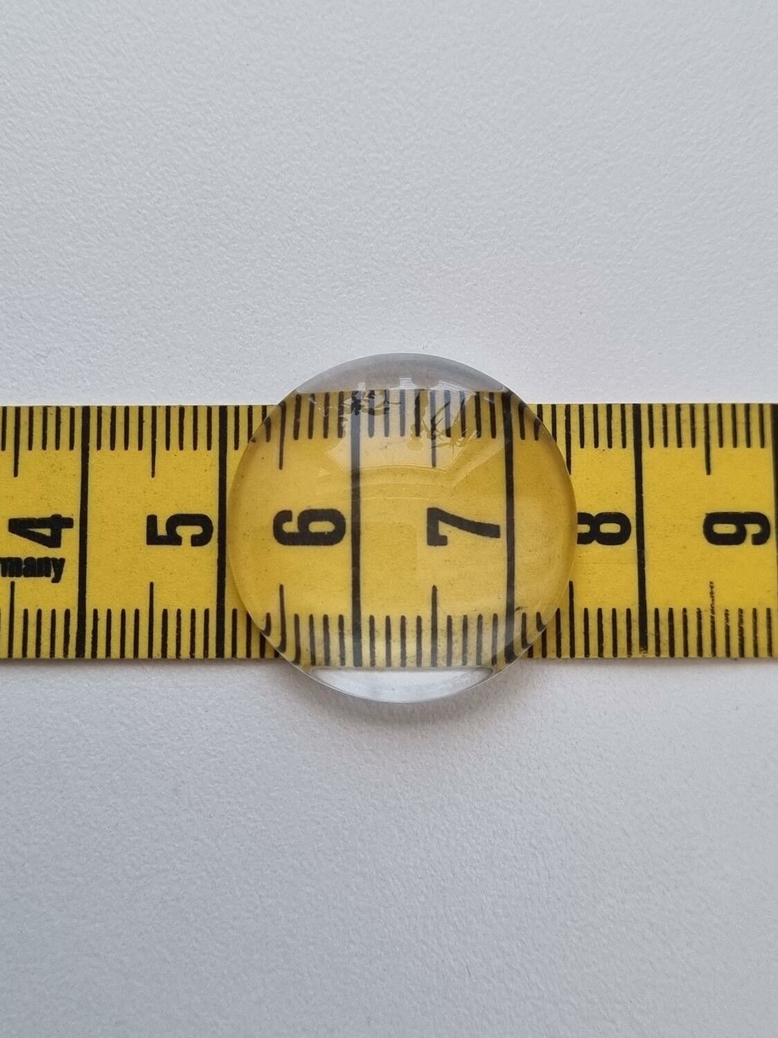 2 st transparenta cabochoner i glas, glasinfattningar (25 mm)