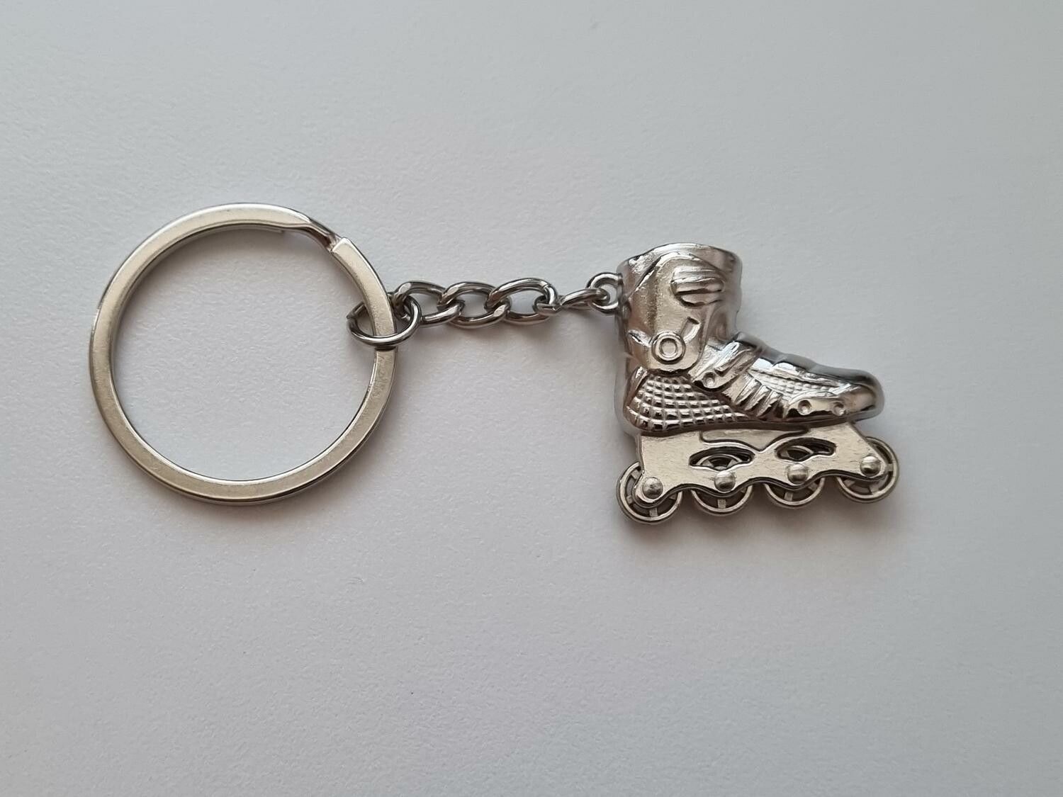 Nyckelring Inlines rullskridskor hänge miniatyr i rostfritt stål