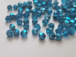 100 st blå bicone pärlor (4 mm)