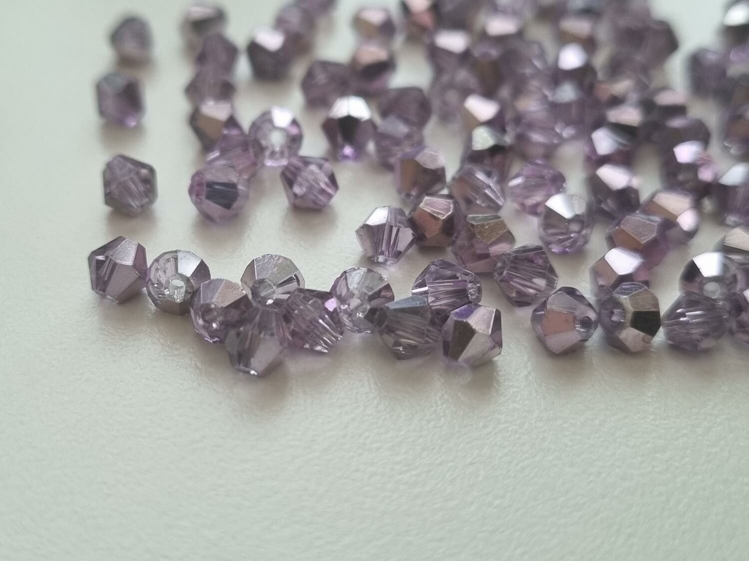 100 st bicone pärlor (4 mm) - Lilafärgade
