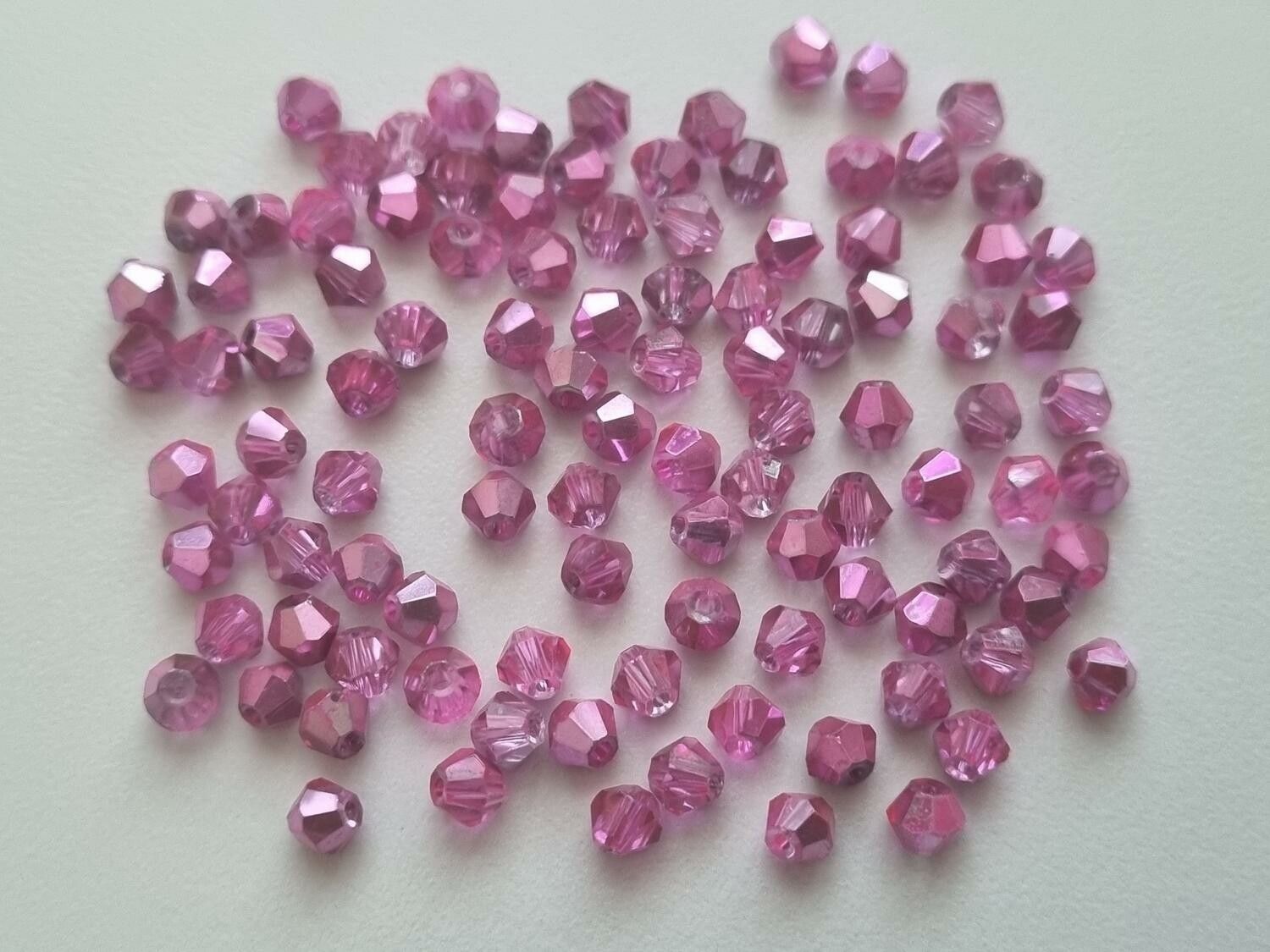 100 st bicone pärlor (4 mm) i rose/cerisefärg
