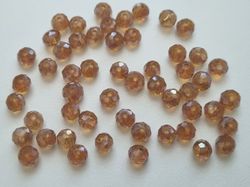 50 st pärlor vackra färger och lyser (4x6 mm) - Guldbrun