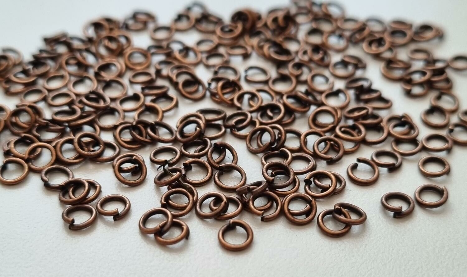 100 st jumprings / bindringar (4 mm, kopparfärgade)