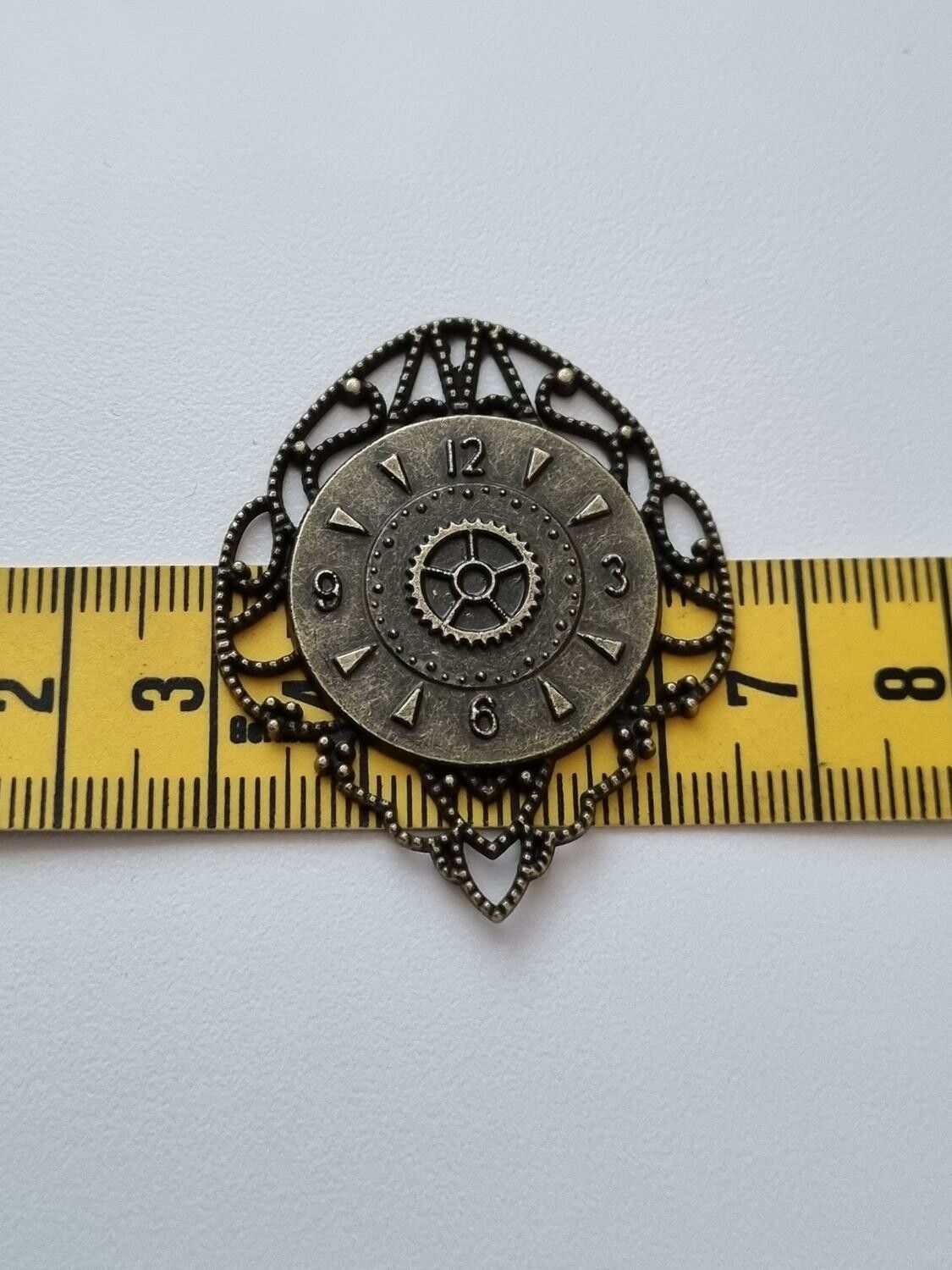 Bronsfärgad berlock, klocka i steampunk, klockberlock