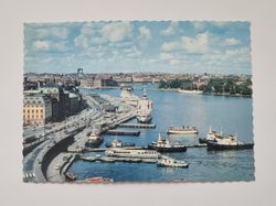 Vykort - Stockholm. Utsikt från Slussen över Skeppsbron