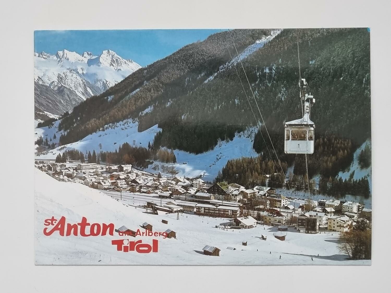 Vykort - St. Anton, 1304 m,am Arlberg - Triol mit Galzigbahn
