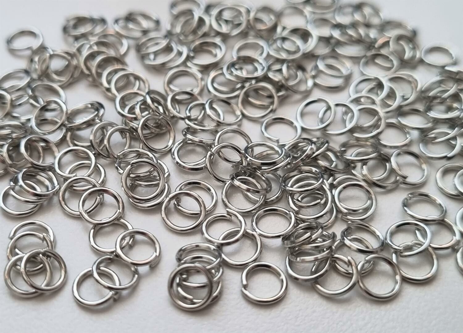 100 st jumprings / bindringar (5 mm, silverfärgade)