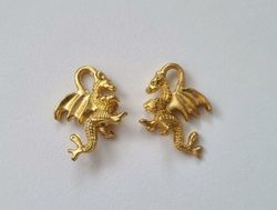2 st guldfärgade drakar. Berlocker / charms