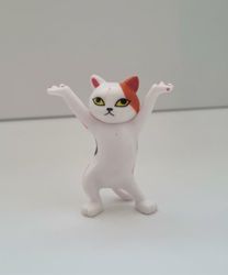 Dansande katt, katt med uppsträckta tassar. Figurin (vit/orange)