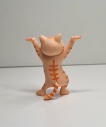 Dansande katt, katt med uppsträckta tassar. Figurin (orange)