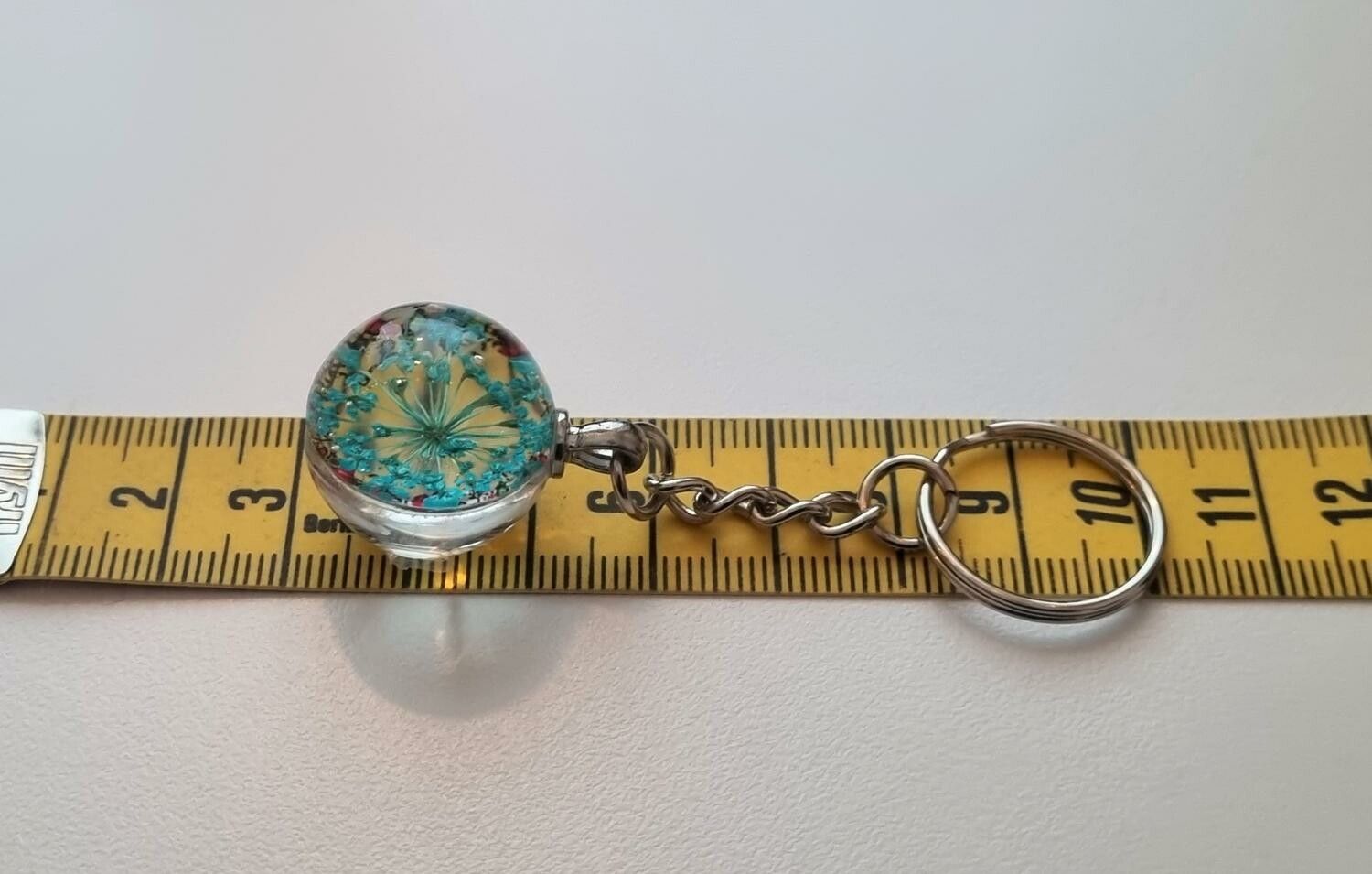 Nyckelring med rund glasberlock (turkos)